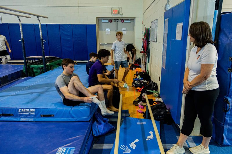 Arlington Tigers gymnasts and coach Sonja Hird Clark inside Barcroft gym