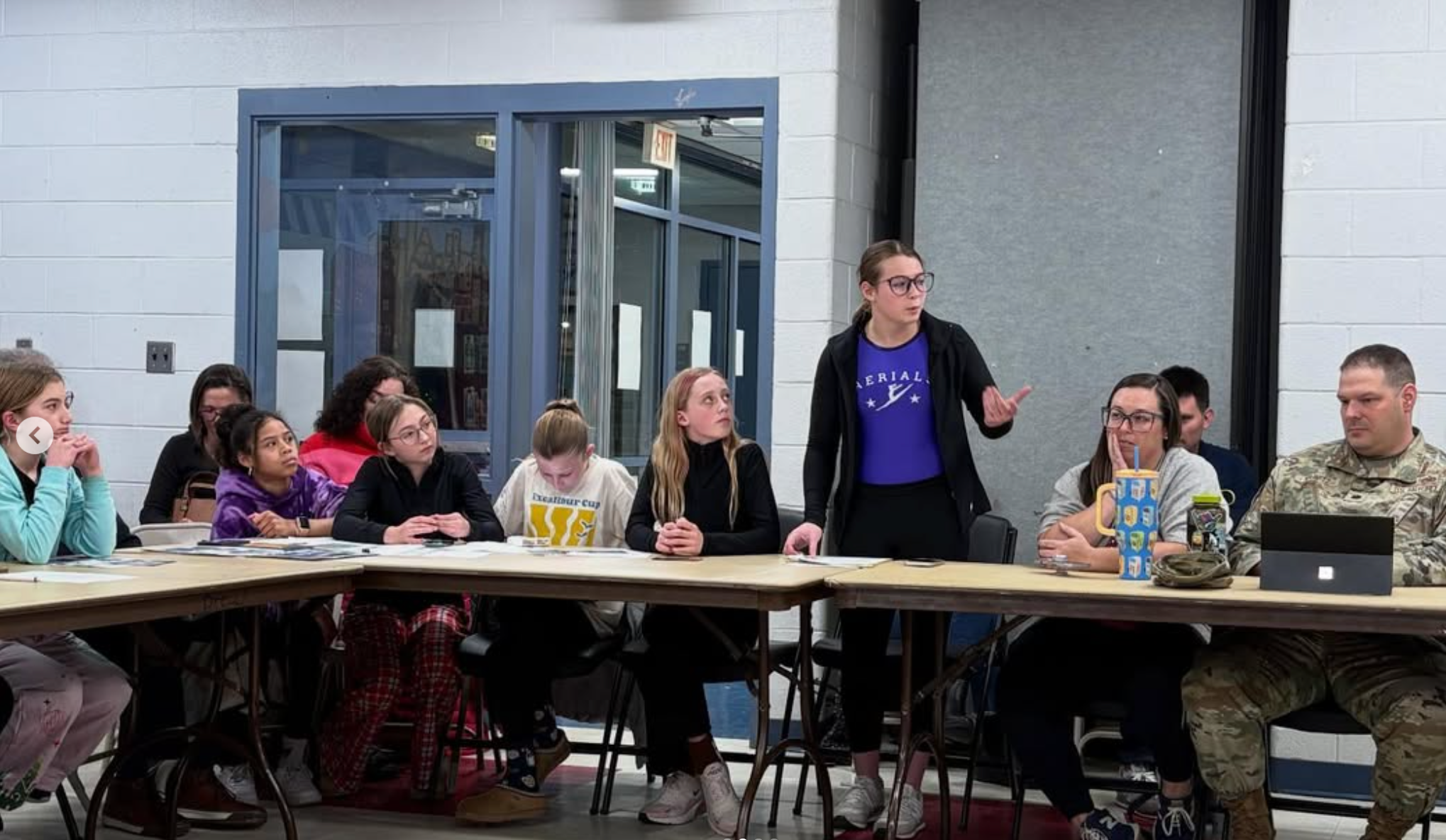 Aerials gymnast speaking at meeting