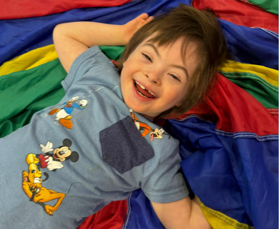 Gabriel doing gymnastics with a big smile