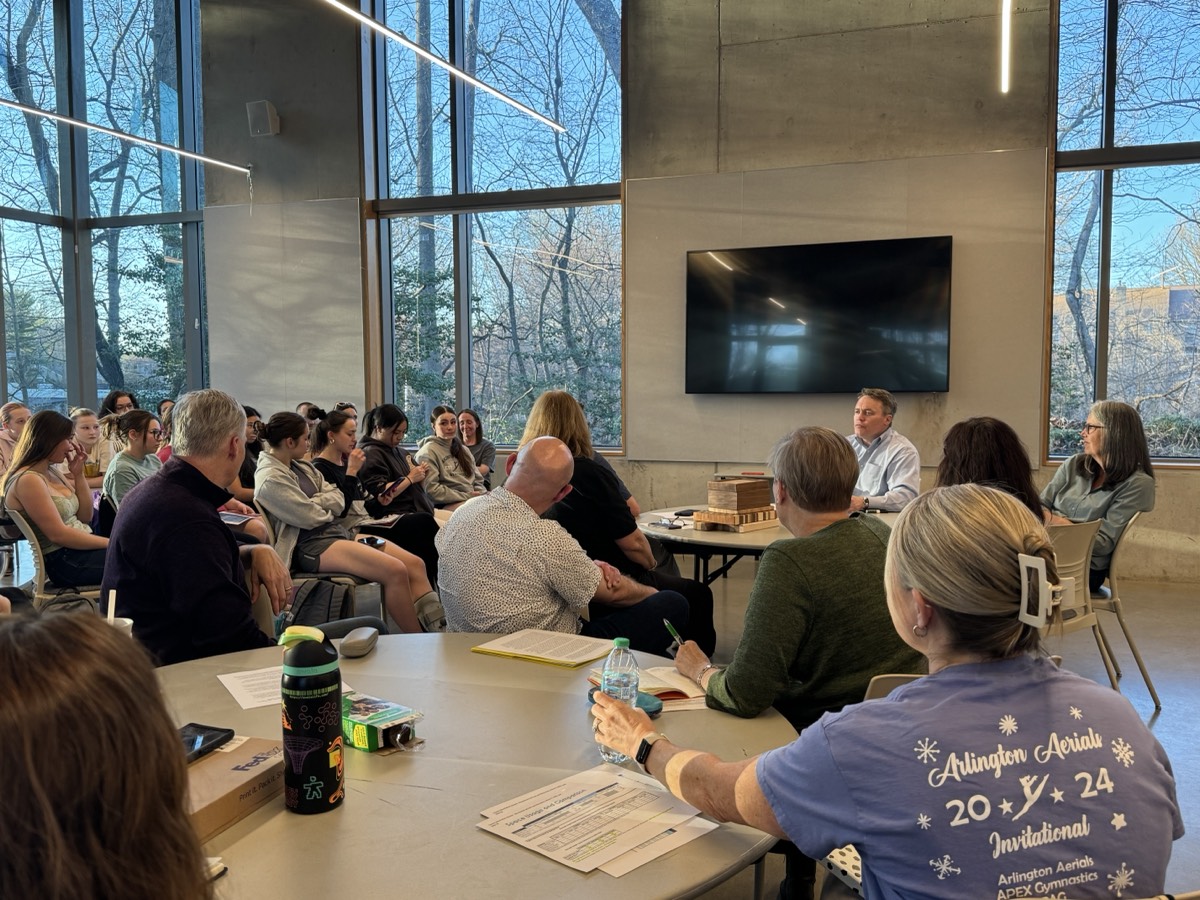 Families and gymnasts filling the room