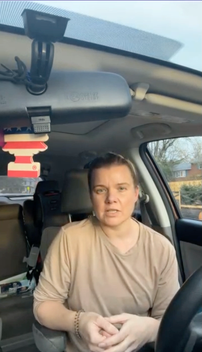 Community member speaking from car